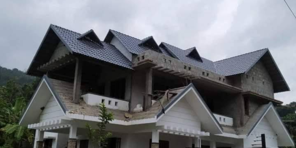 Luxury home with stone-coated tile roof under construction by Roofopolis