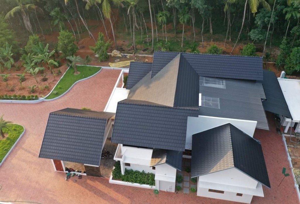 Multi-gable villa with premium flat tiles by Roofopolis