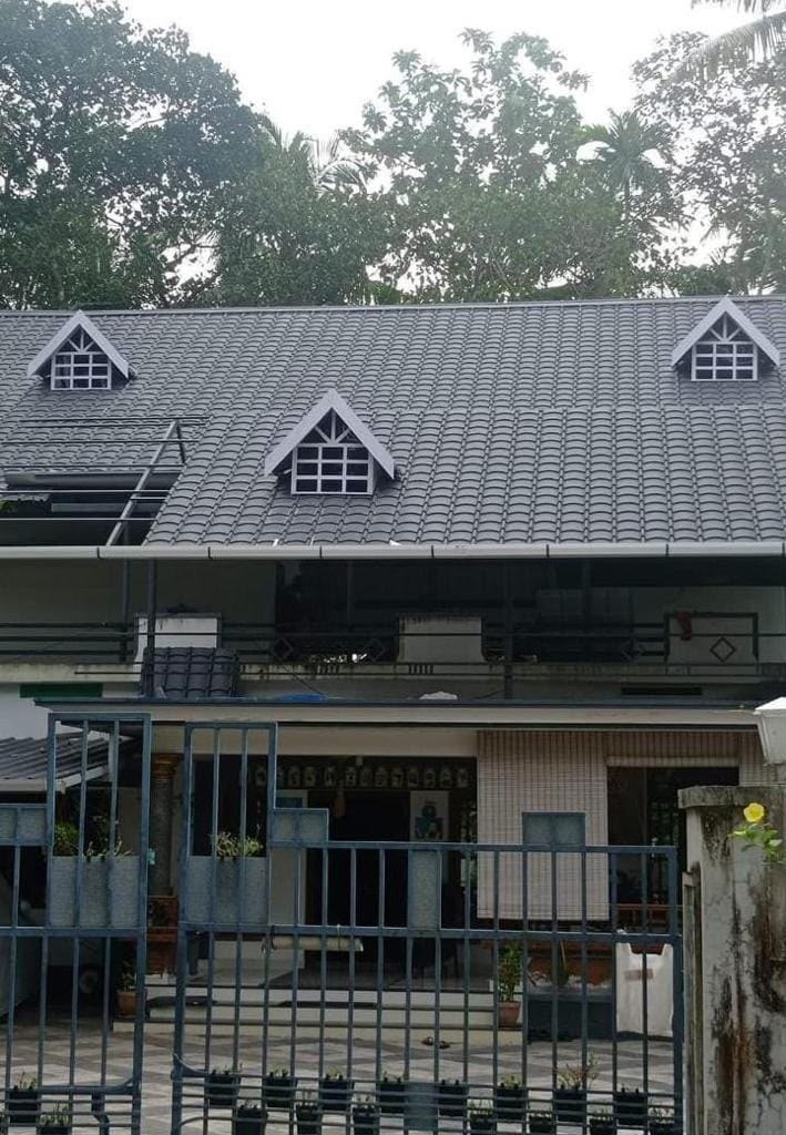 Residential multi-gable home with clay tile roof by Roofopolis