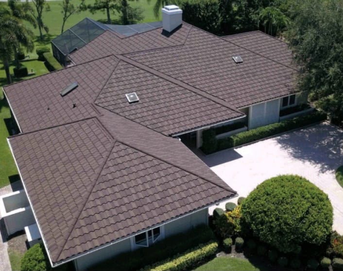 Luxury estate with dark brown stone-coated tiles by Roofopolis