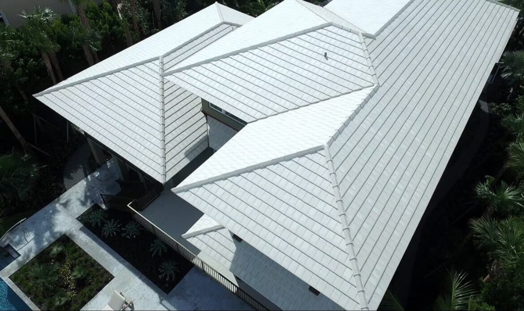 Luxury home with slate white tile roof by Roofopolis