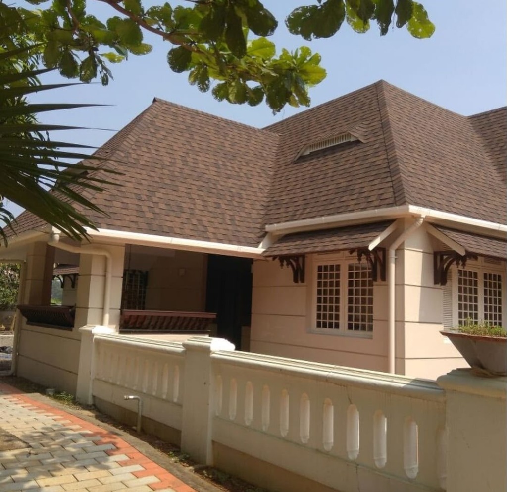 Luxury residential home with brown shingles by Roofopolis