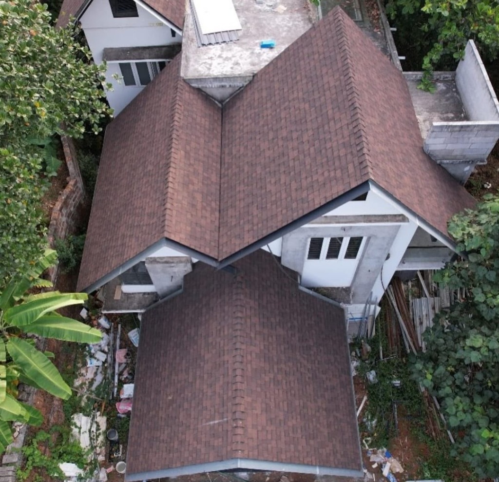 Aerial view of brown shingle house by Roofopolis
