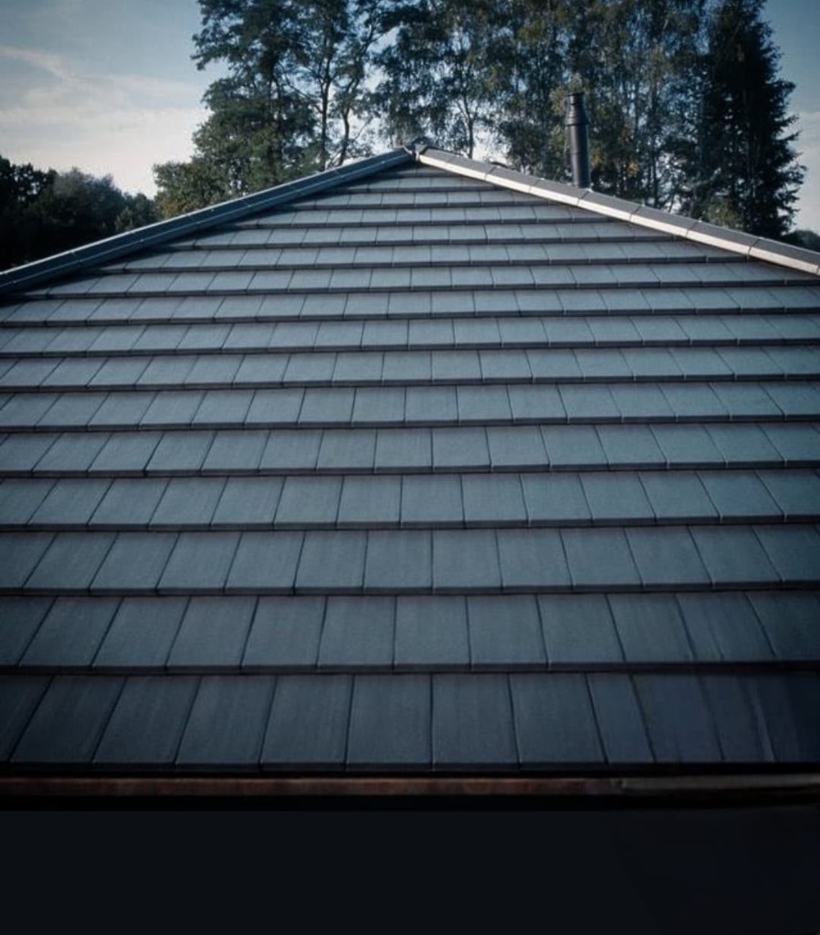 Imported terracotta flat tile roof with dormer